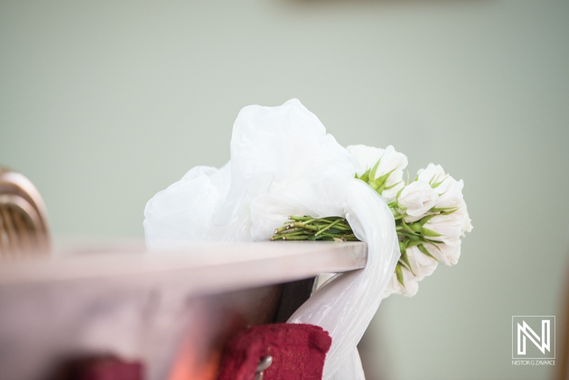 Church bench wedding decoration with flowers and ribbon