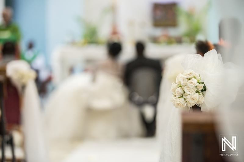 Church bench wedding decoration with flowers and ribbon