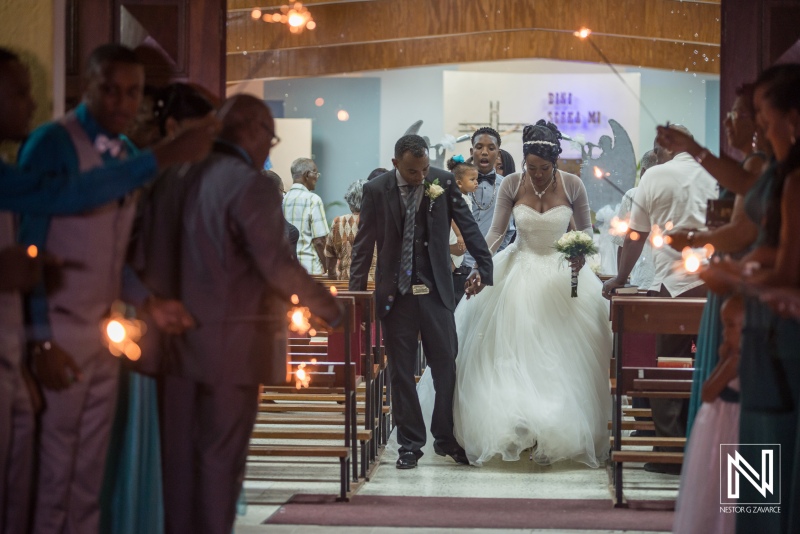 Sparkle departure of the bride and groom in the church