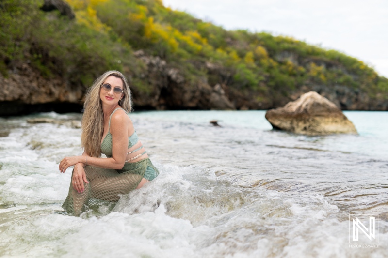 Model enjoying the warm waters of Curacao during a vibrant portrait session amidst beautiful natural scenery