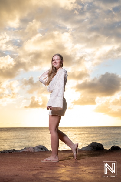 Beautiful sunset portrait in Curacao featuring a woman in light clothing by the ocean