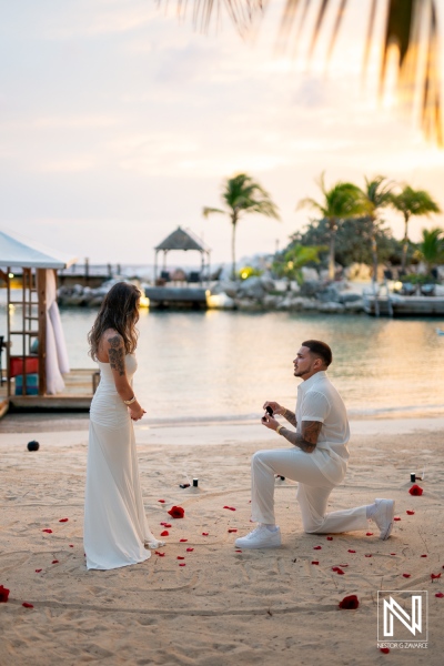 Couple enjoys wedding proposal at Baoase Luxury Resort in Curacao during sunset on the beach
