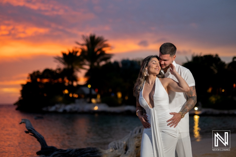 Couple shares a wedding proposal moment at Baoase Luxury Resort in Curacao during sunset