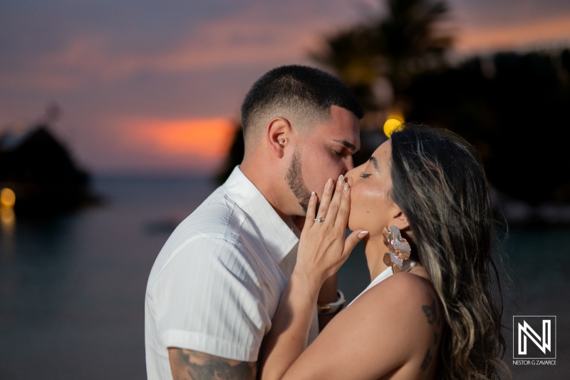 Person proposes to partner at Baoase Luxury Resort in Curacao during sunset