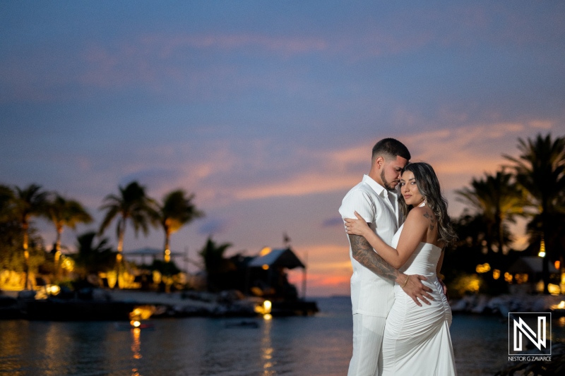 Couple celebrates wedding proposal at Baoase Luxury Resort in Curacao during sunset on the beach