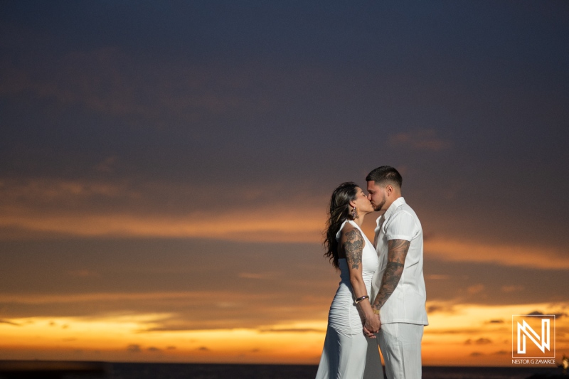 Couple celebrates wedding proposal at Baoase Luxury Resort in Curacao during sunset