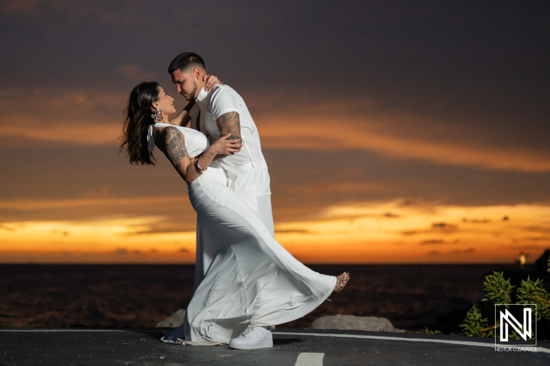 Couple celebrates engagement during sunset at Baoase Luxury Resort in Curacao