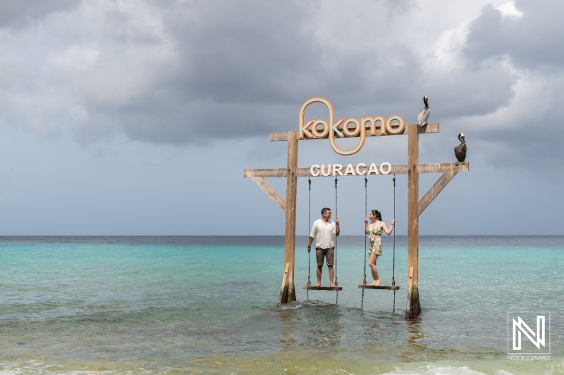 Romantic wedding proposal at Kokomo Beach in Curacao during sunset by the sea