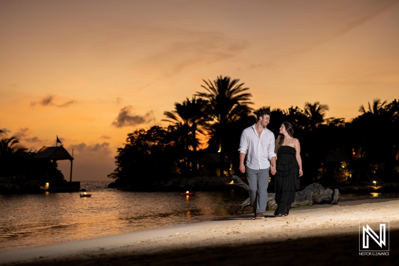 Couple enjoys a wedding proposal moment at Baoase Luxury Resort in Curacao during sunset