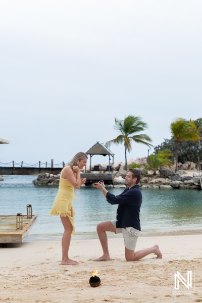 Romantic wedding proposal at Baoase Luxury Resort in Curacao during a stunning sunset by the beach