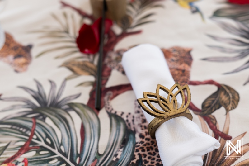 Romantic wedding proposal setup with elegant lotus napkin rings at Baoase Luxury Resort during a stunning sunset in Curacao