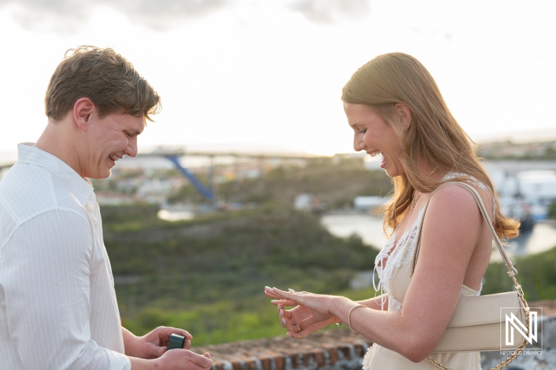 Wedding proposal at Fort Nassau in Curacao with joyful couple and scenic view