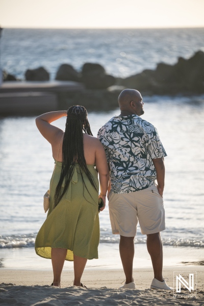 Couple enjoys sunset view at Avila Beach Hotel in Curacao during wedding proposal