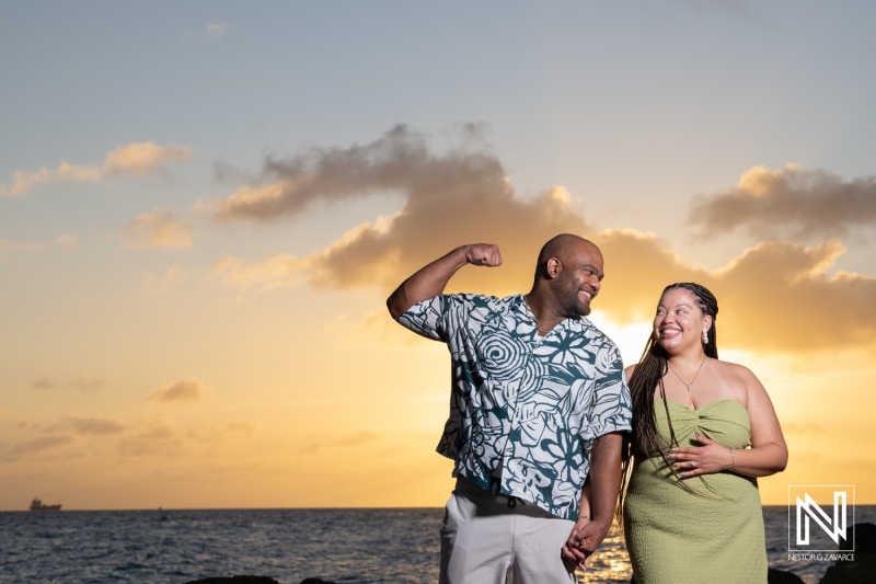Couple enjoys a wedding proposal at Avila Beach Hotel in Curacao during sunset