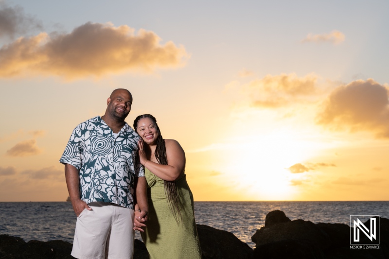 Couple enjoys moment during wedding proposal at Avila Beach Hotel at sunset in Curacao