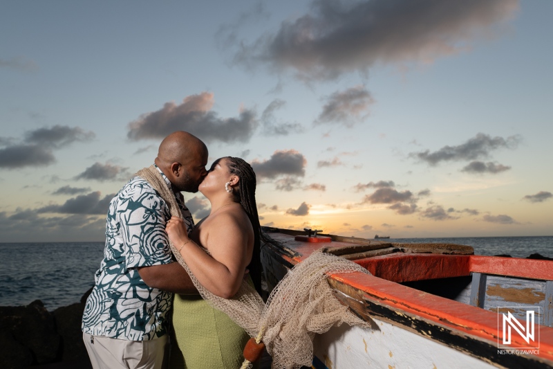 Couple shares an intimate moment during wedding proposal at Avila Beach Hotel in Curacao