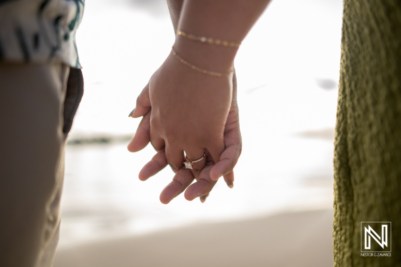 Couple holds hands during a wedding proposal at Avila Beach Hotel in Curacao