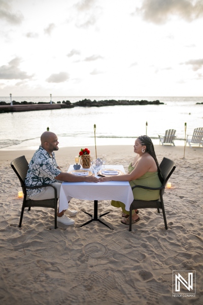 Couple enjoys wedding proposal at Avila Beach Hotel in Curacao by the water during sunset