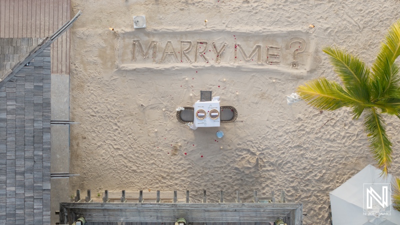 Couple enjoys wedding proposal at Avila Beach Hotel in Curacao on the beach