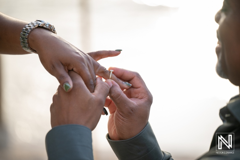 Couple enjoys wedding proposal moment at Avila Beach Hotel in Curacao during a sunset gathering