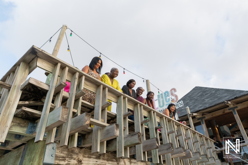 Wedding proposal moment at Avila Beach Hotel in Curacao with family and friends present celebrating love