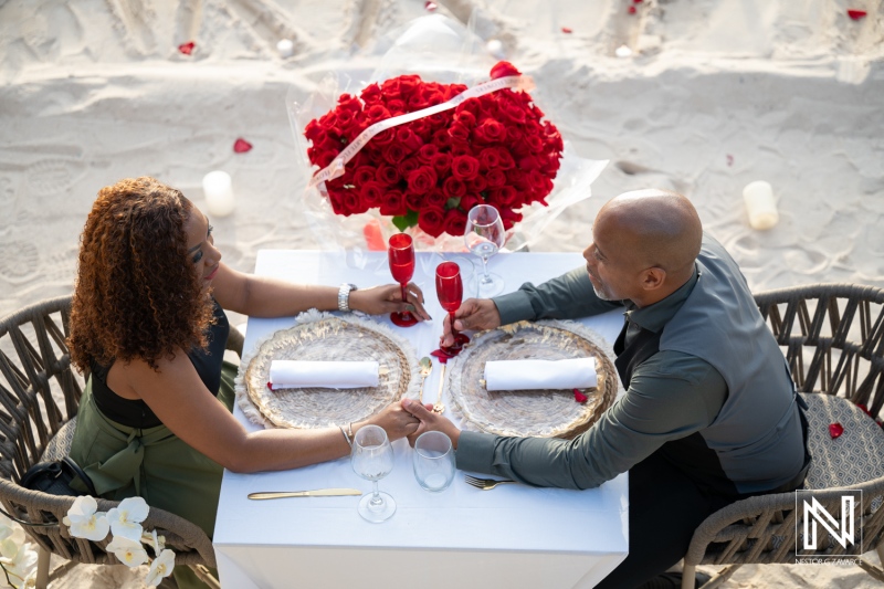 Couple shares a special moment during a wedding proposal at Avila Beach Hotel in Curacao
