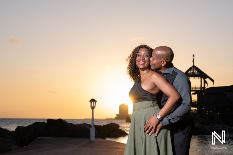 Couple enjoys wedding proposal at Avila Beach Hotel in Curacao during sunset