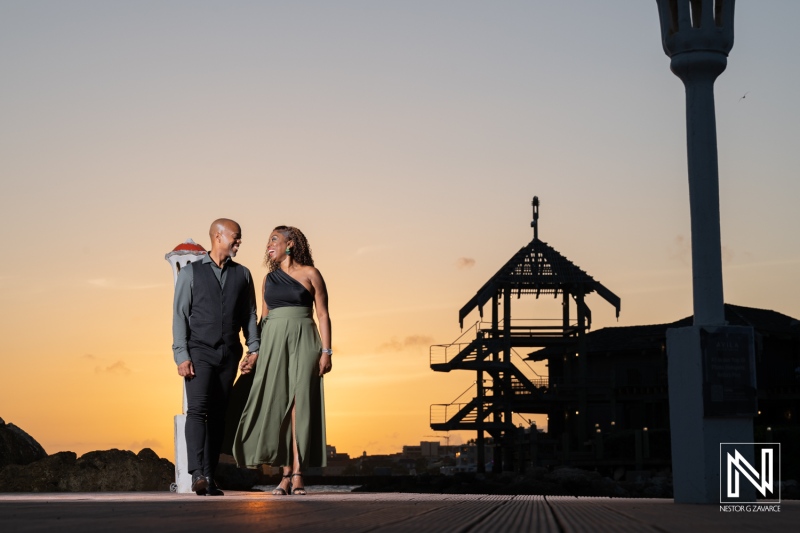 Wedding proposal at Avila Beach Hotel in Curacao during sunset with a couple enjoying the moment