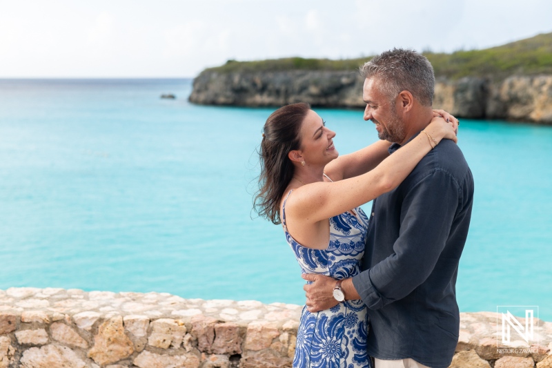 Couple celebrates wedding proposal at Grote Knip beach in Curacao with beautiful ocean background