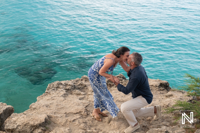 Couple enjoys a wedding proposal at Grote Knip in Curacao during a sunny day