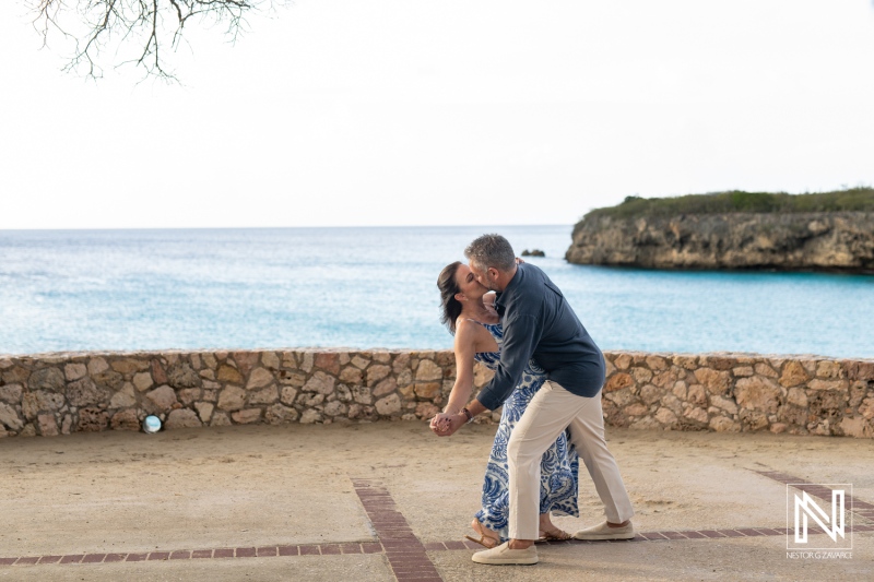 Couple celebrates wedding proposal at Grote Knip in Curacao during sunset