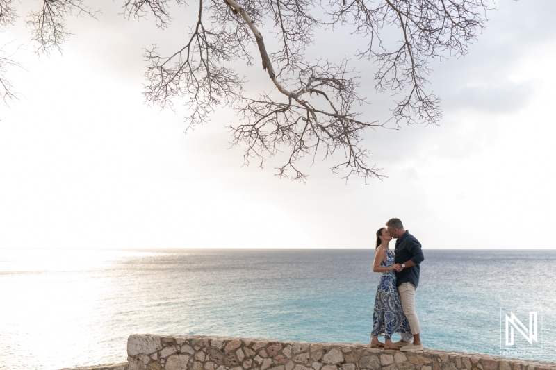 Couple gets engaged during a wedding proposal at Grote Knip in Curacao near the ocean