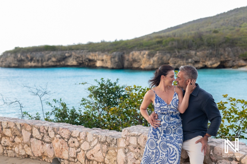 Couple celebrates wedding proposal at Grote Knip in Curacao with scenic views of the ocean and cliffs