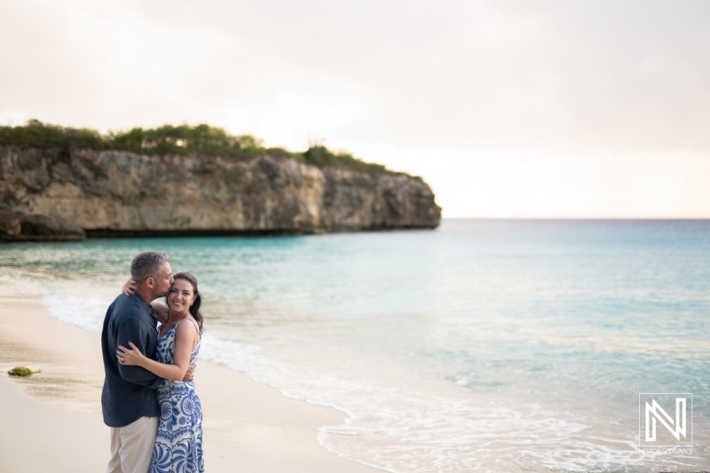 Couple shares a special moment during a wedding proposal at Grote Knip in Curacao while standing on the beach