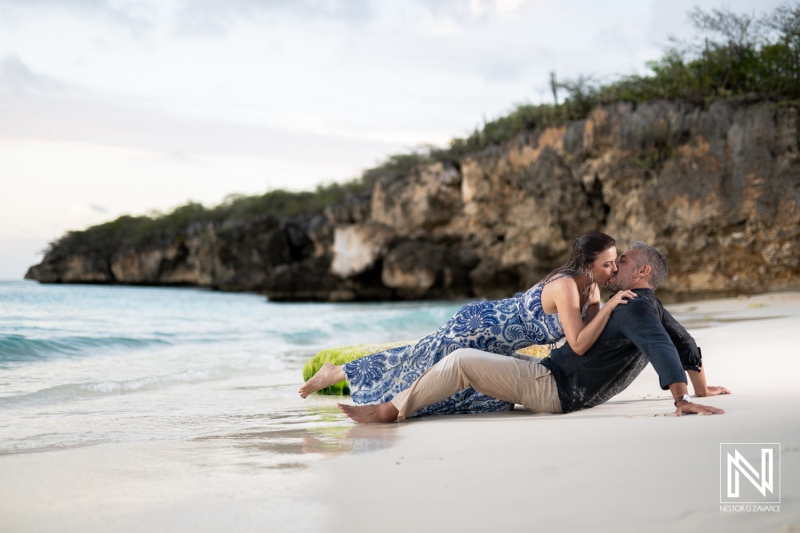 Couple engages in wedding proposal at Grote Knip beach in Curacao against a stunning coastal backdrop