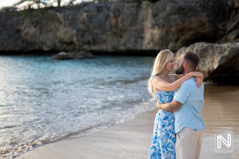 Romantic couple captures at Playa Jeremi during sunset, Curacao, perfect wedding proposal setting