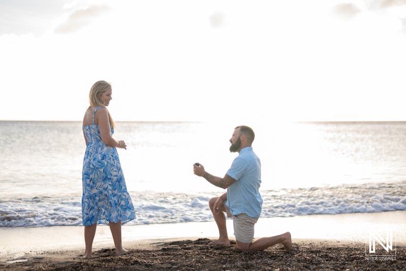 Couple captures unforgettable wedding proposal at Playa Jeremi during a stunning sunset in Curacao