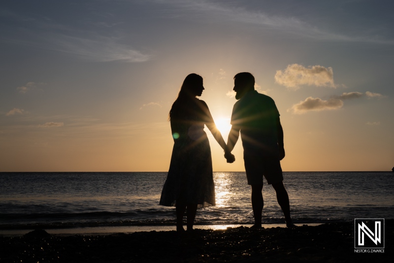 Couple enjoys sunset at Playa Jeremi in Curacao during a romantic wedding proposal moment