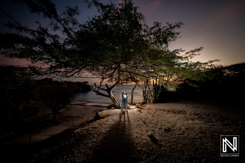 Couple captures a romantic wedding proposal at sunset on Playa Jeremi in Curacao surrounded by nature and tranquility