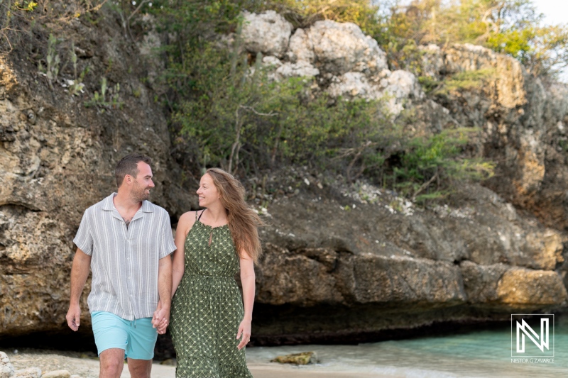Romantic wedding proposal at Daaibooi Beach during sunrise in Curacao captures a special moment between a couple