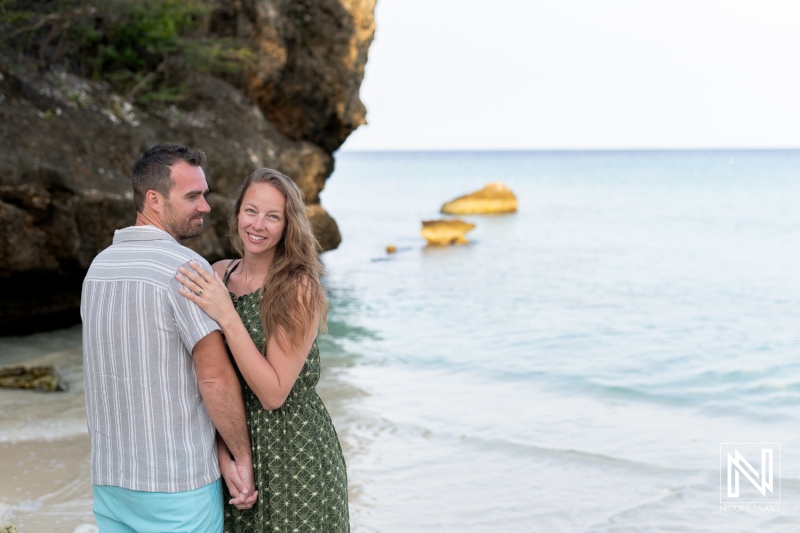 Couple enjoys romantic sunrise wedding proposal at Daaibooi Beach in Curacao