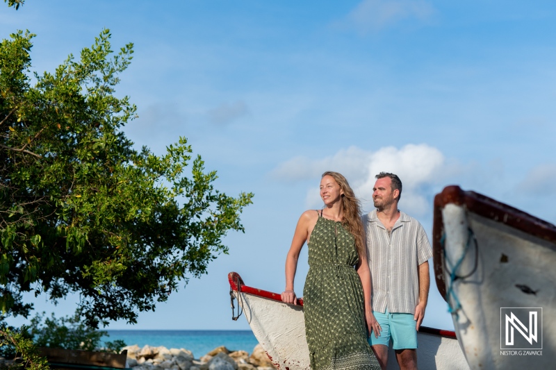 Couple enjoys a romantic sunrise wedding proposal at Daaibooi Beach in Curacao, creating unforgettable memories with breathtaking views