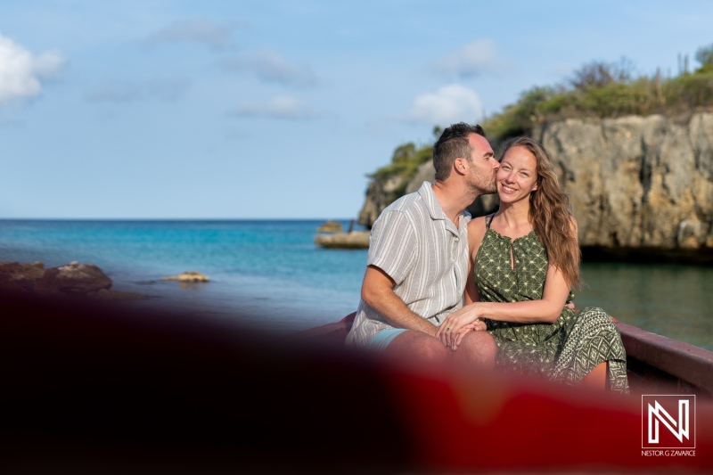 Couple enjoys romantic sunrise wedding proposal at Daaibooi Beach in Curacao with stunning views and love-filled moments
