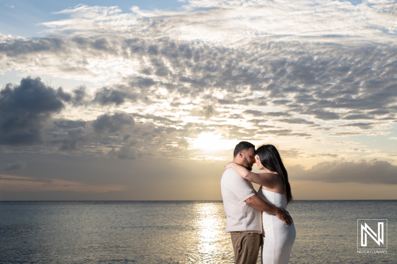 Couple enjoys wedding proposal at Daaibooi Beach during sunset in Curacao