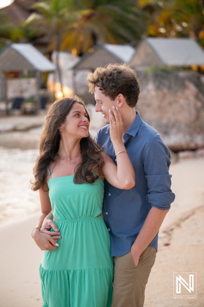 Couple enjoys a wedding proposal at Baoase Luxury Resort in Curacao with beautiful beach in the background