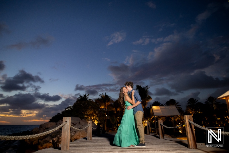 Couple celebrates wedding proposal at Baoase Luxury Resort in Curacao during sunset with beautiful scenery in the background