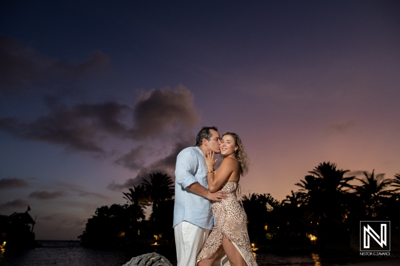Couple shares a special moment during a wedding proposal at Baoase Luxury Resort in Curacao at sunset