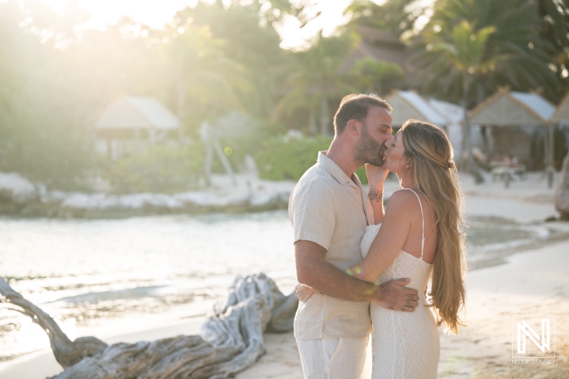 Couple shares a joyful wedding proposal at Baoase Luxury Resort in Curacao during sunset