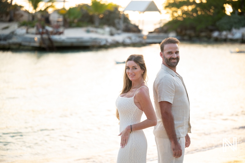 Couple enjoys a wedding proposal moment at Baoase Luxury Resort in Curacao during sunset