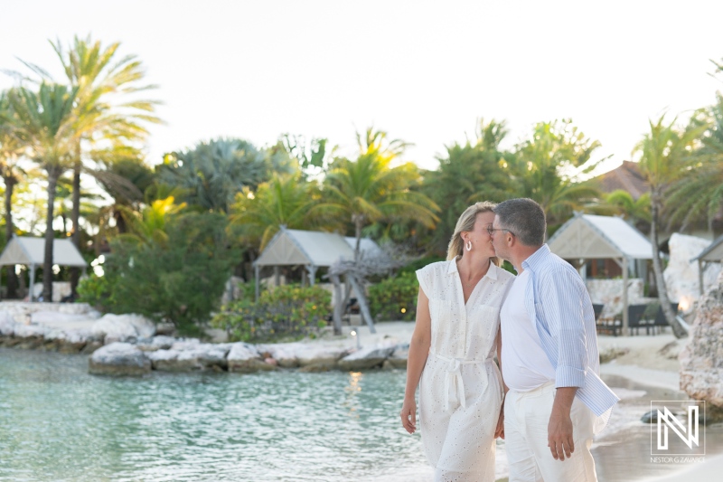Couple celebrates wedding proposal at Baoase Luxury Resort in Curacao near the beach during sunset